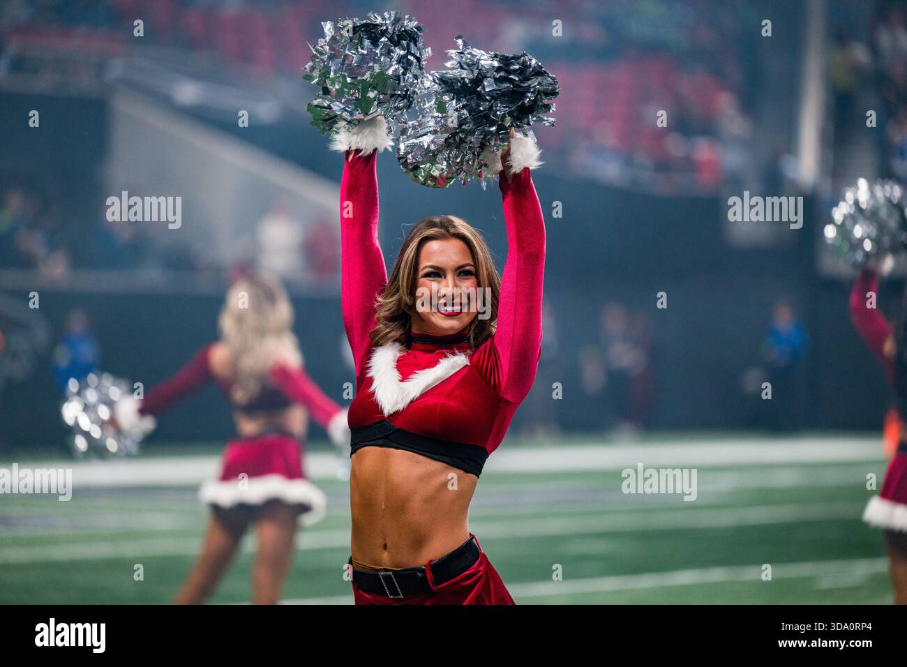 An Atlanta Falcons cheerleader performs before an NFL football game ...