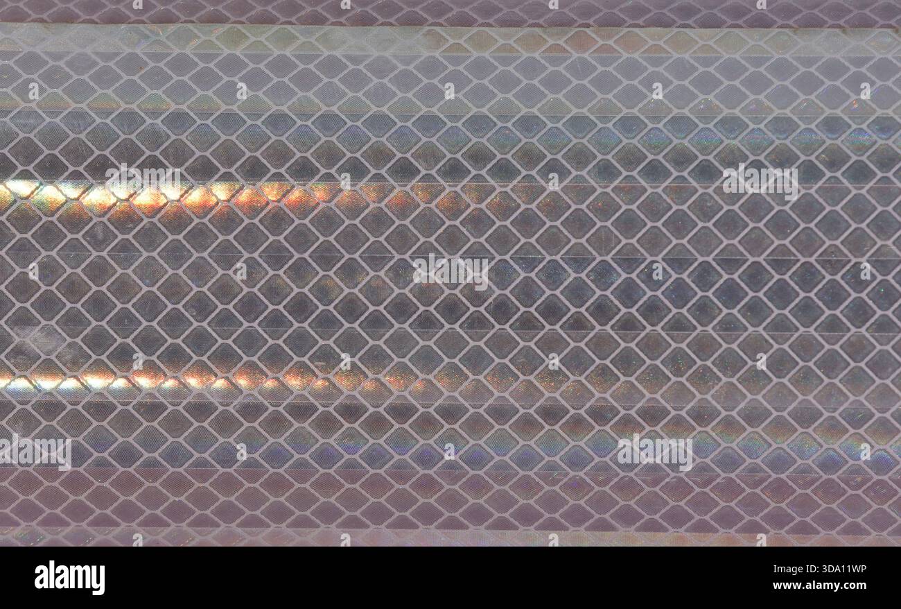 Diamond-patterned mesh close-up abstract textured background Stock Photo