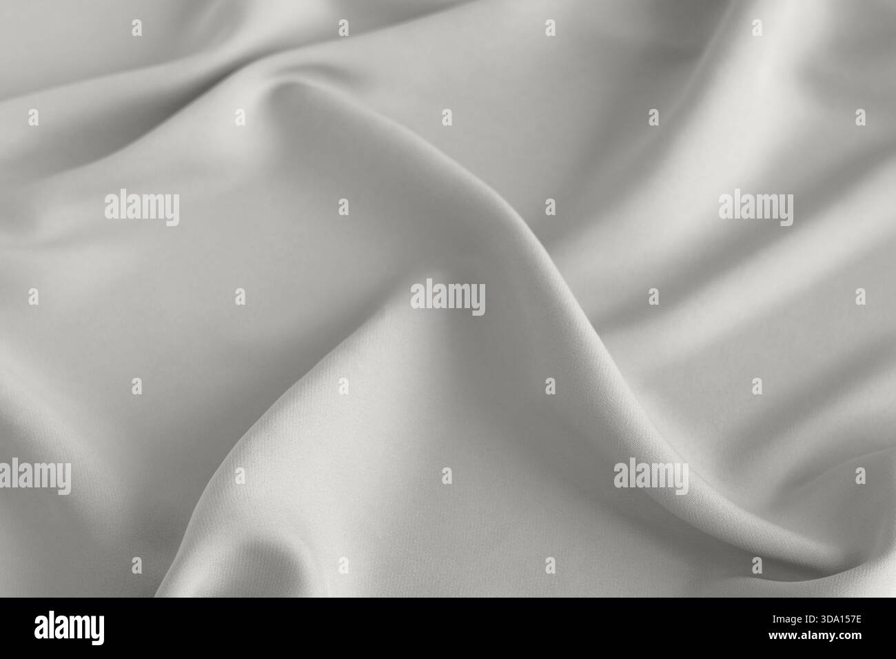 Soft white fabric draped in smooth folds for background and texture ...