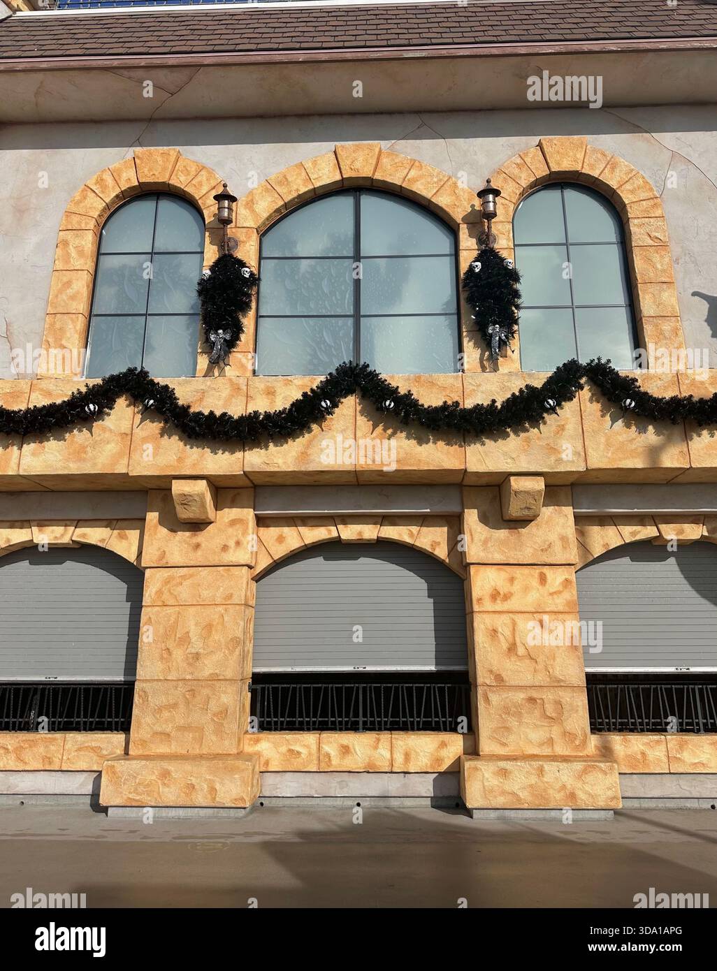 Holiday Garland on Stone Arch Windows - Smartphone Captured Stock Image