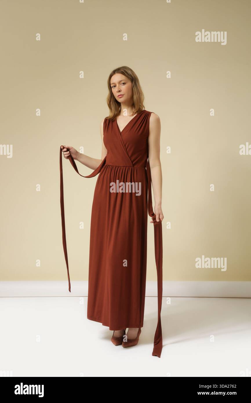 Woman in brown dress hi-res stock photography and images - Alamy