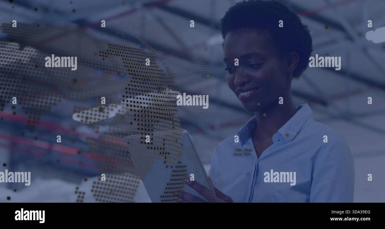 Using engineer wearing blue shirt checking tablet inside warehouse, dotted map overlay, copy space Stock Photo