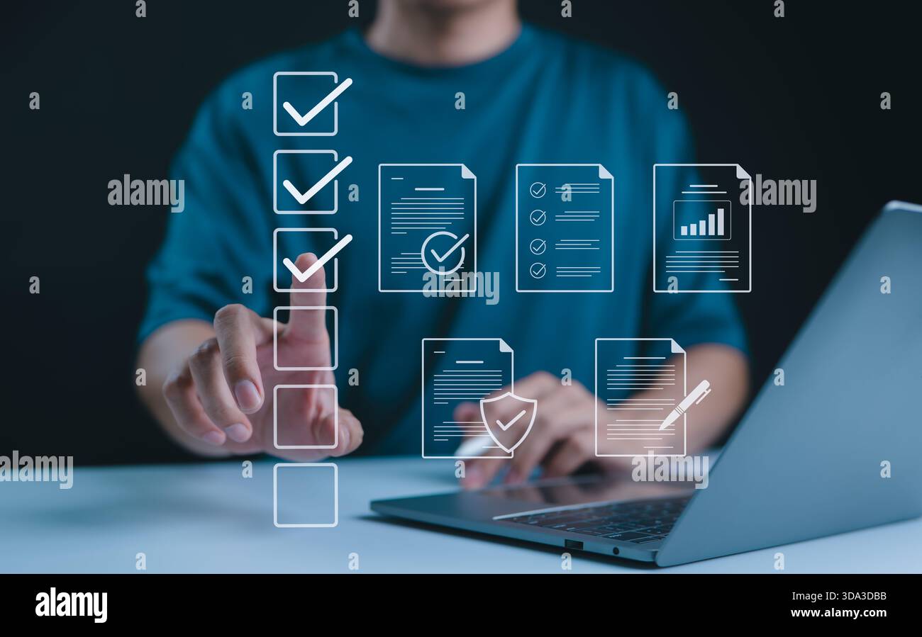 Digital form checklist, Online survey concept. Person interacts with digital form checklist on laptop with process of filling out online survey and co Stock Photo