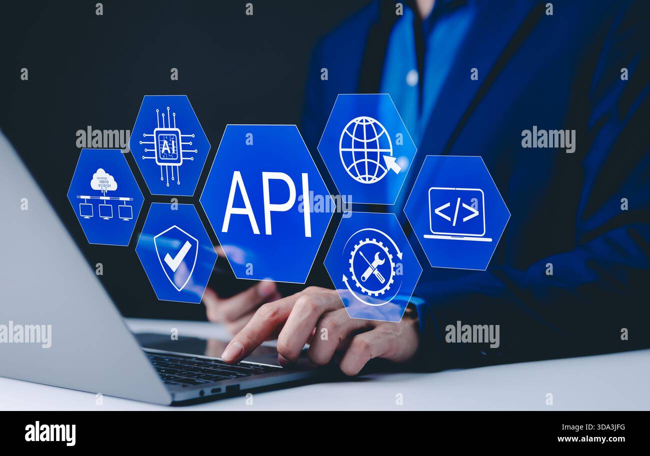 API Application Programming Interface Concept. A programmer types on a laptop, interacting with digital icons representing API development, security, Stock Photo