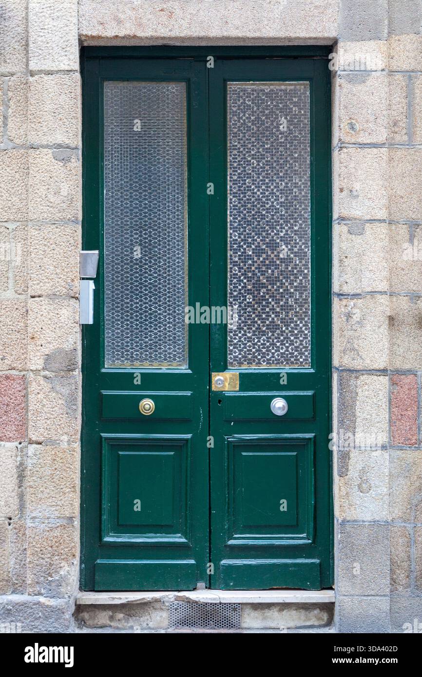 green exterior door with glass panels, double door entrance way Stock Photo