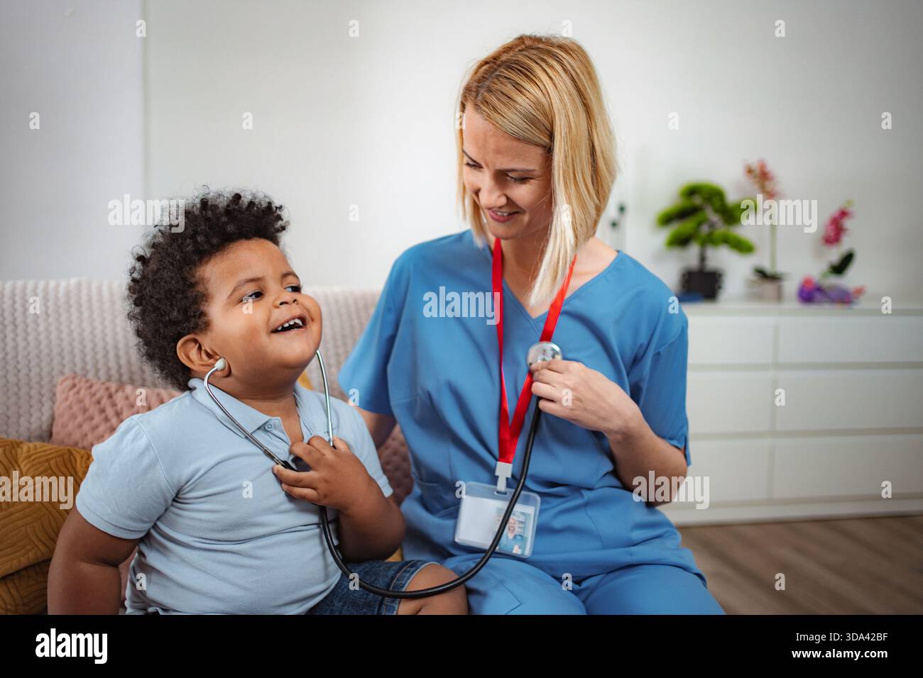 Doctor Routine Checkup Doctor performing routine checkup on child Stock Photo - Alamy