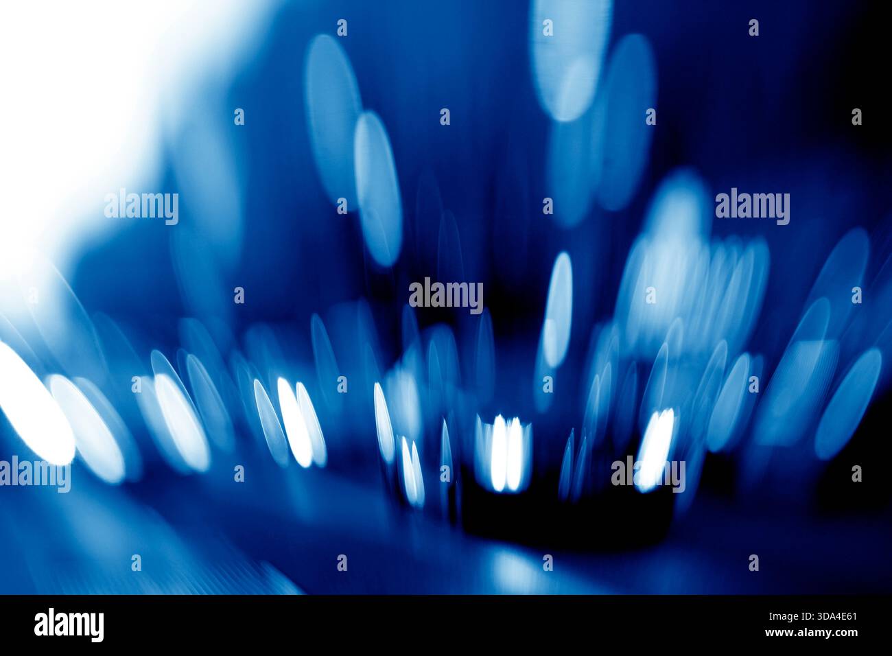Abstract background with blurred blue lights creating oval shapes Stock Photo