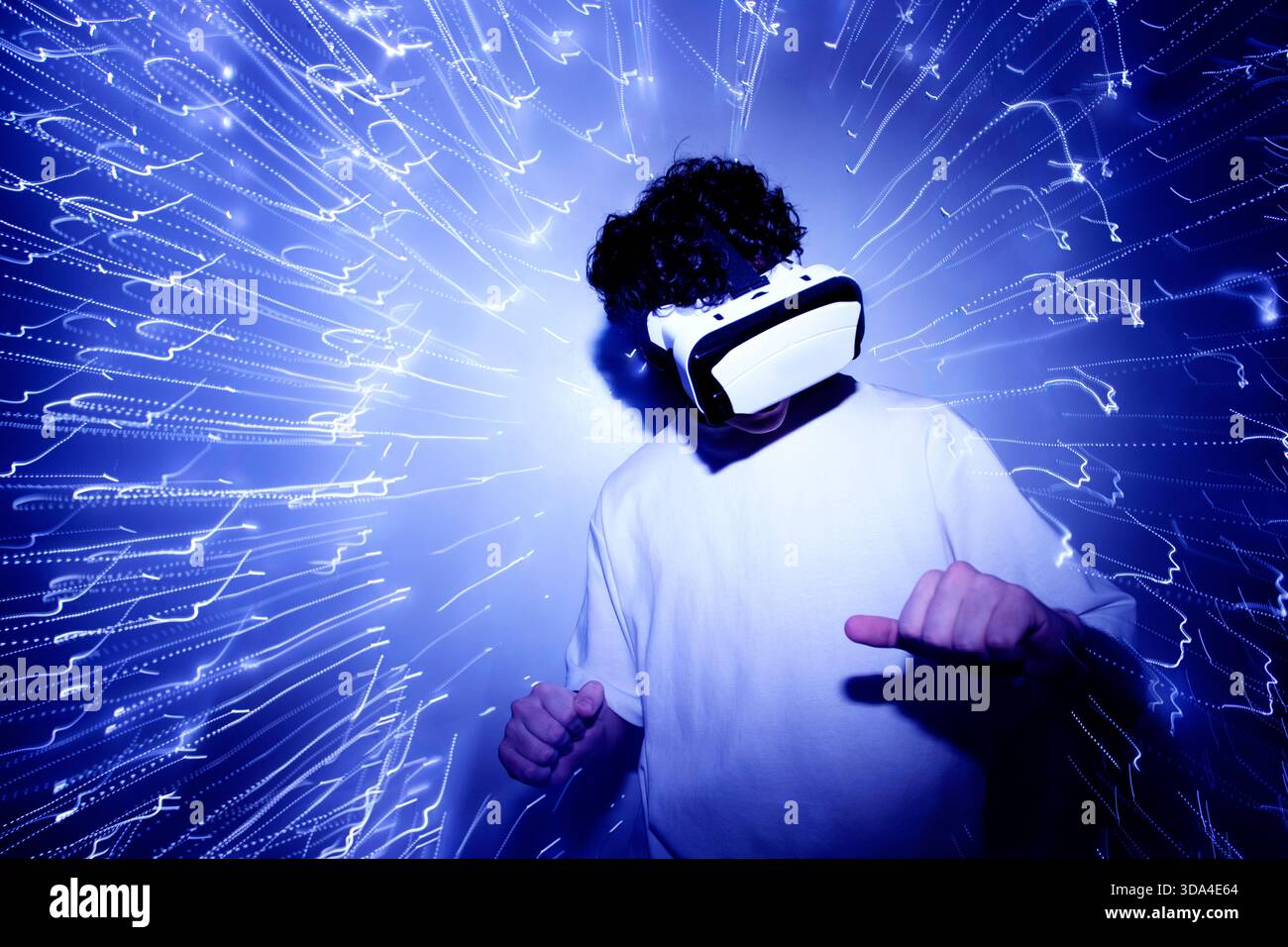 person with virtual reality goggles and lights Stock Photo