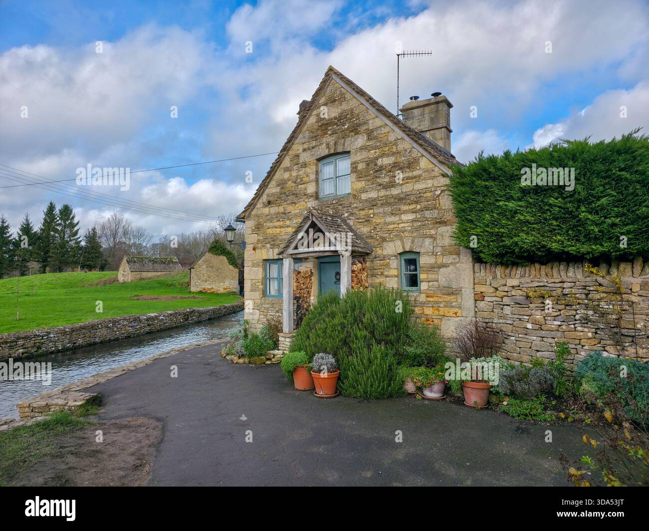 Charming Riverside Stone Cottage in Lower Slaughter, Cotswolds England Uk - Smartphone Captured Stock Image