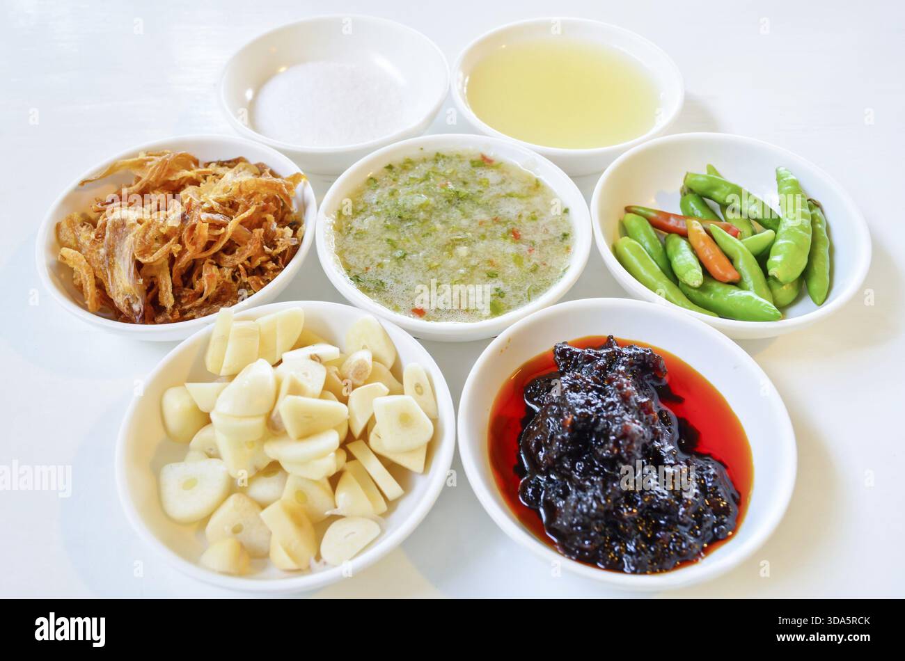 Thai food condiment in a separate small cups Stock Photo