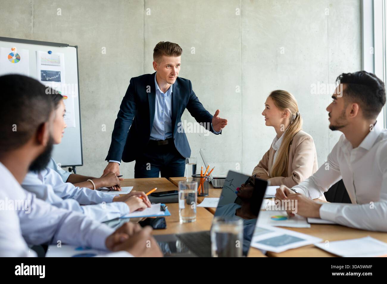 Diverse team presenting charts hi-res stock photography and images - Alamy
