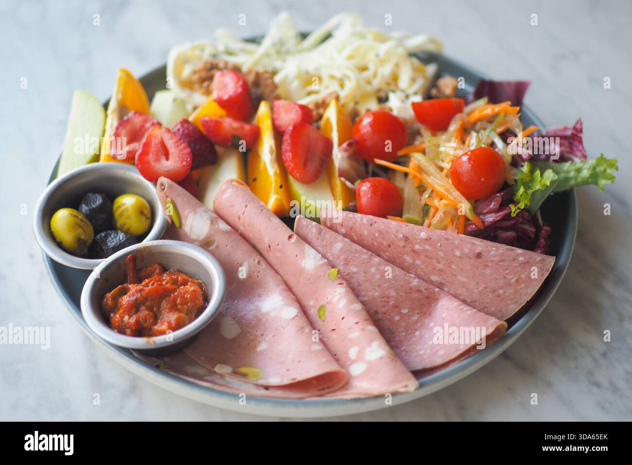 Fresh salad and deli platter at a restaurant lunch Stock Photo