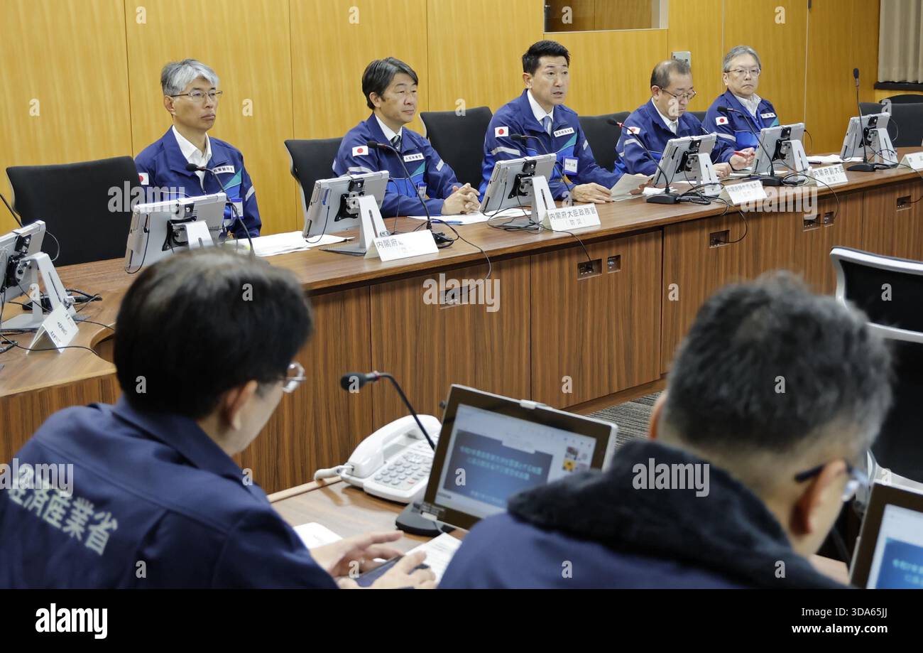 A government disaster response meeting is held at the Cabinet Office in ...