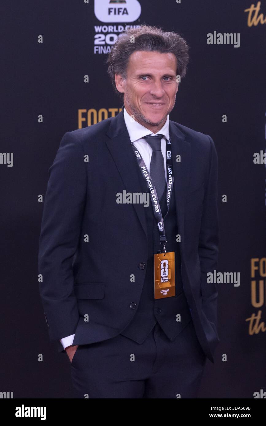 Diego Forlan poses on the red carpet upon arrival to attend the draw ...