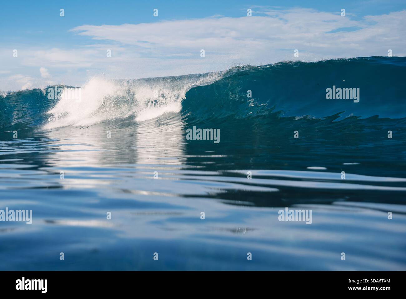 Ocean blue wave. Crashing surfing wave Stock Photo