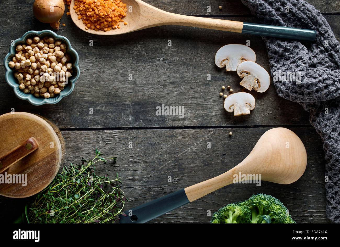 cooking tools on rustic dark wooden table surface, top view Stock Photo