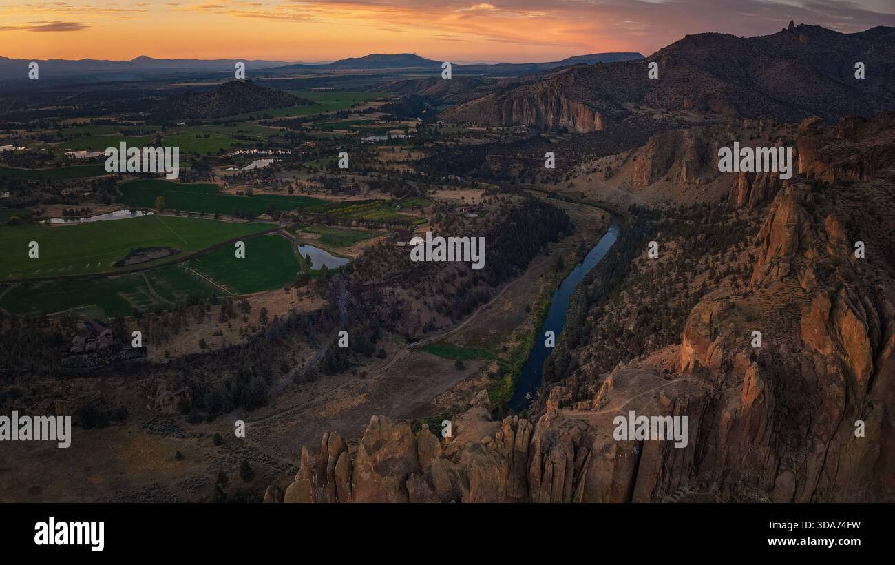 Aerial view of a winding river cutting through rugged canyons and ...