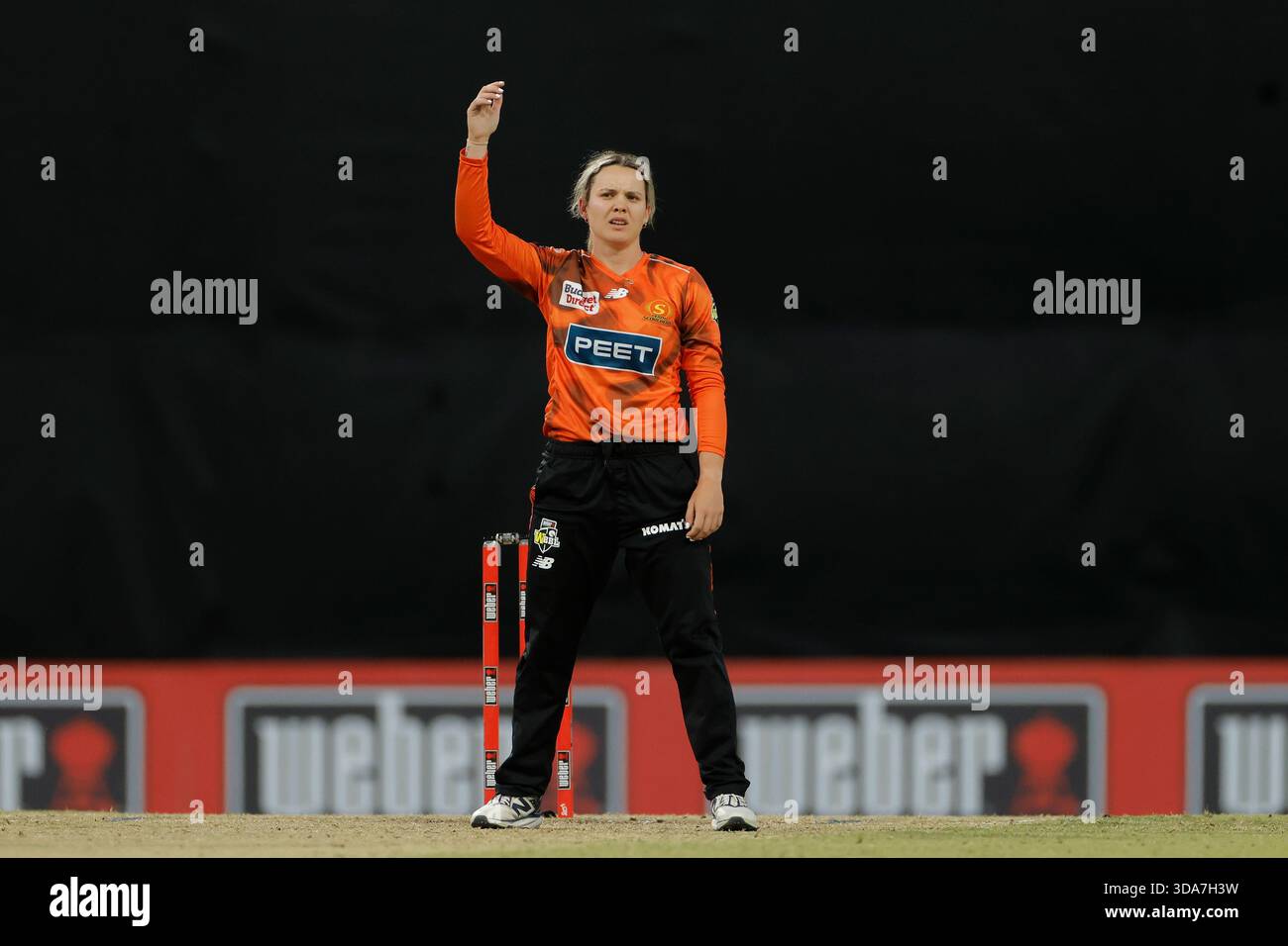 Lilly Mills of the Scorchers reacts after bowling during the WBBL ...