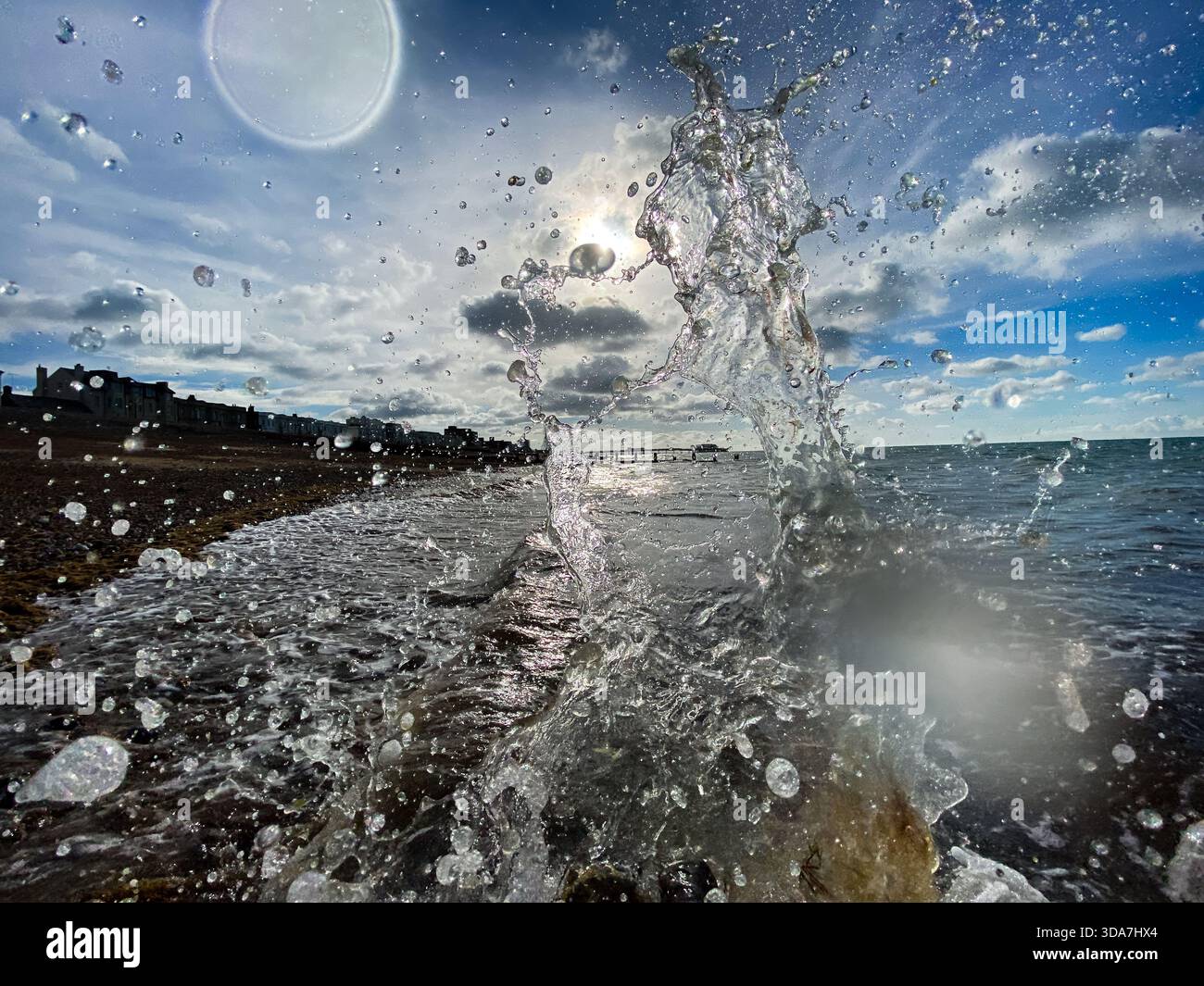 A close up of Waves splashing on worthing beach - Smartphone Captured Stock Image