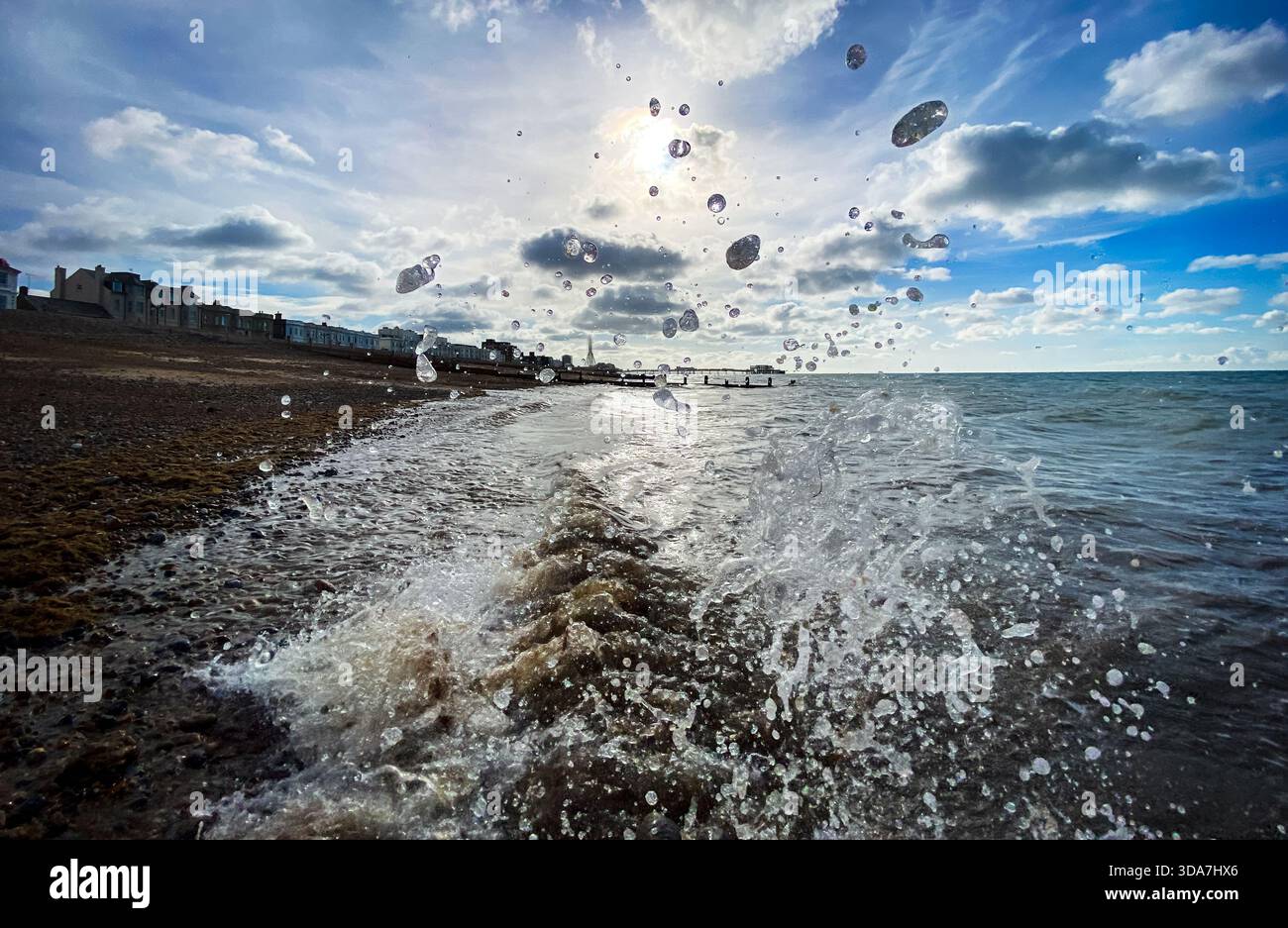 A close up of Waves splashing on worthing beach - Smartphone Captured Stock Image