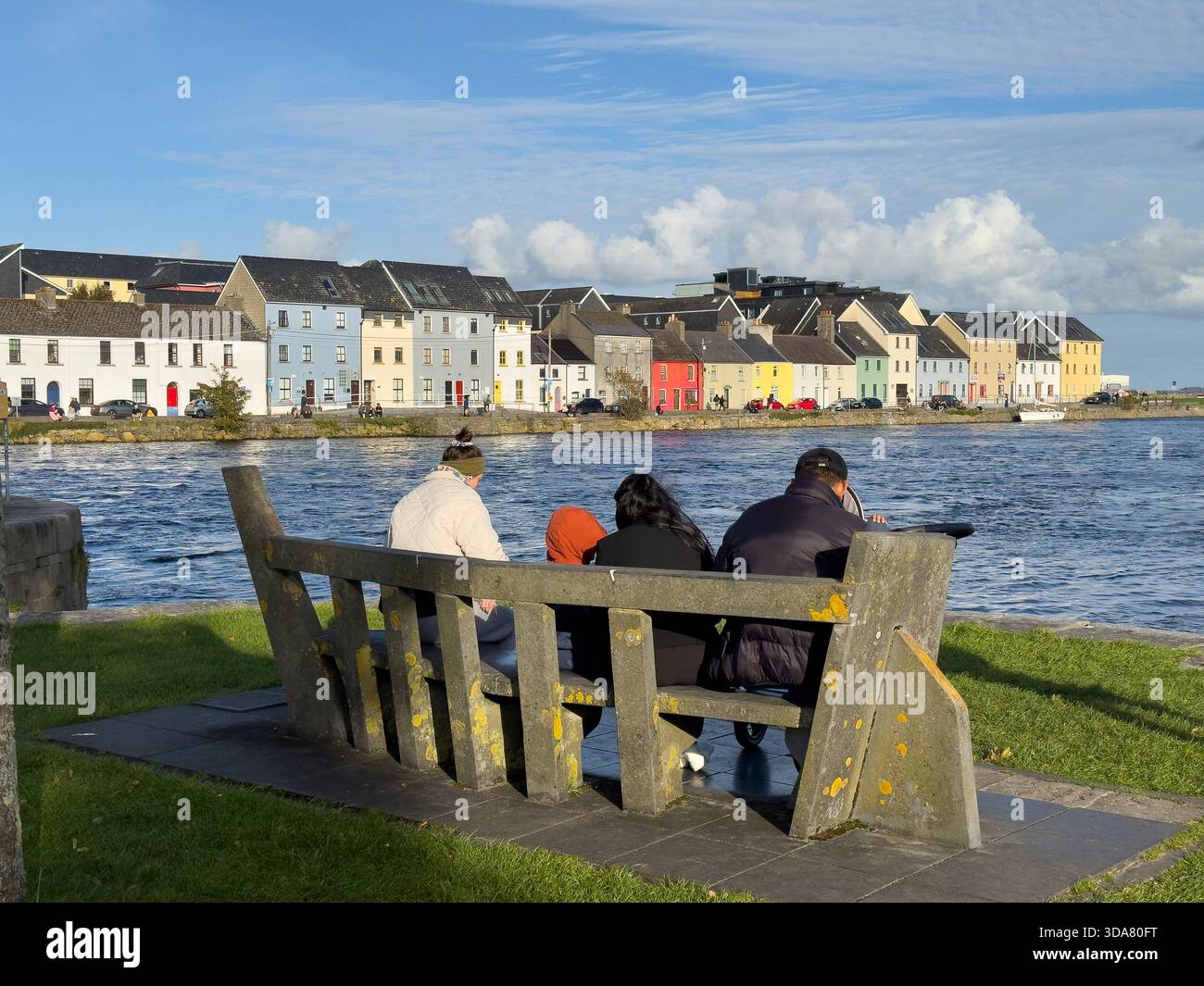 A brisk Autumn sunny day in Galway horbour, Ireland , looking towards The Long Walk across the water Stock Photo