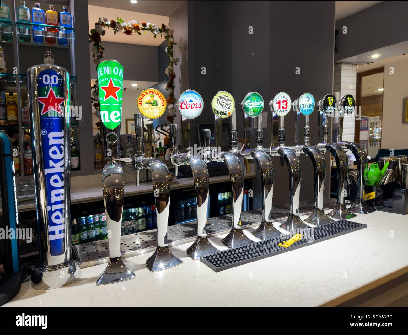 A row of beer dispensing taps in an Irish hotel pub - Smartphone Captured Stock Image