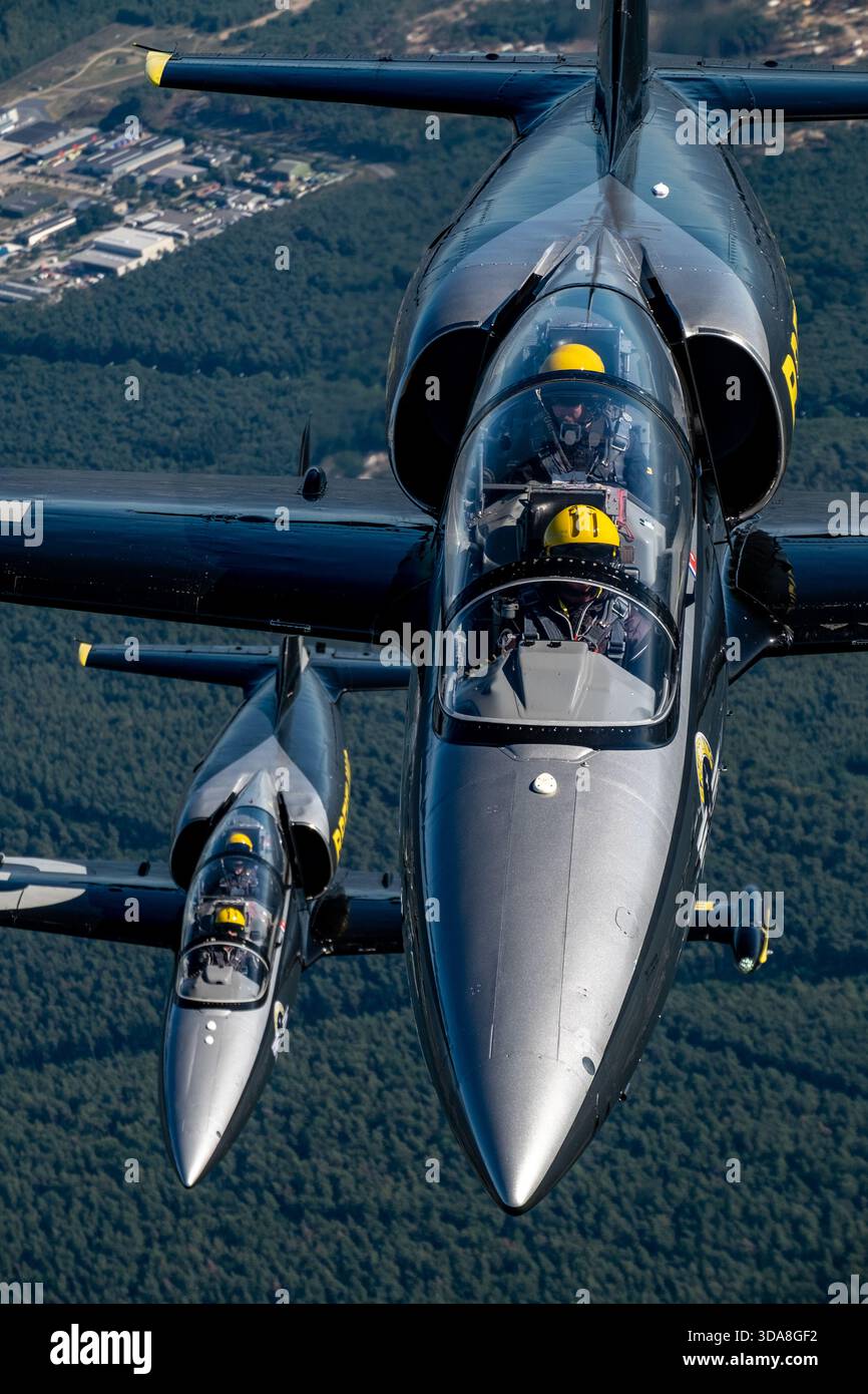 Streamlined Jet Air-to-air photograph of two Breitling Aero L-39 Albatros jets flying ...