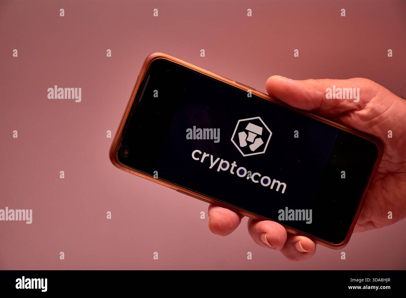 Vigo, Spain, November 30, 2025.A human hand holds a smartphone whose screen  displays the logo of Crypto.com, an international cryptocurrency platform  Stock Photo - Alamy
