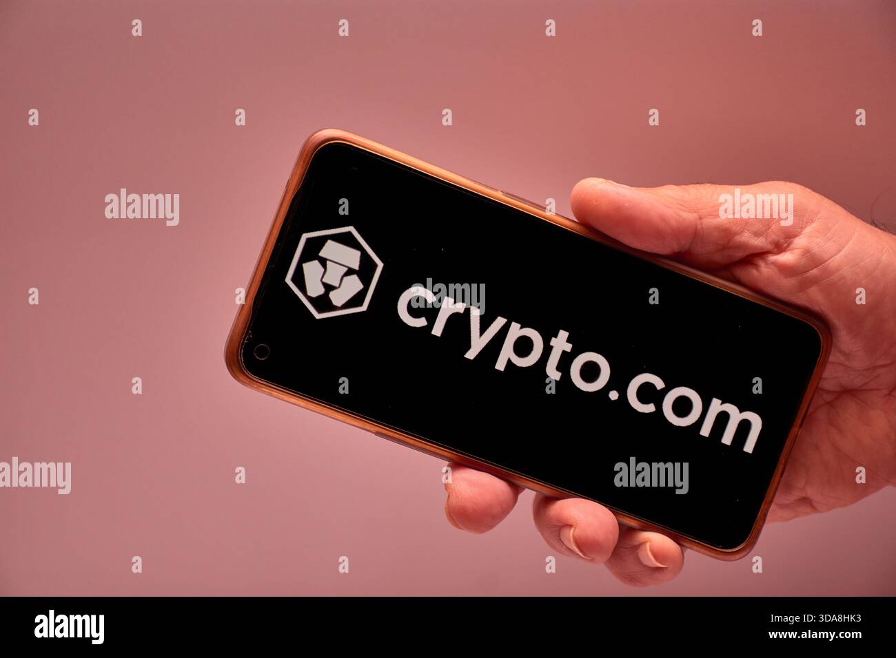 Vigo, Spain, November 30, 2025.A human hand holds a smartphone whose screen  displays the logo of Crypto.com, an international cryptocurrency platform  Stock Photo - Alamy
