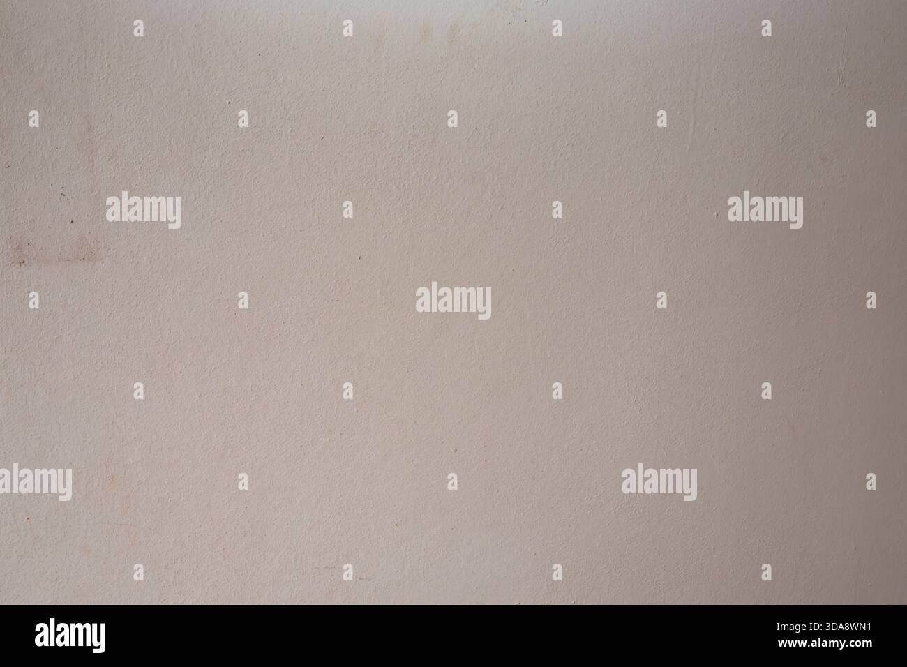 Beige textured wall background with subtle grain pattern for clean minimalist design projects Stock Photo