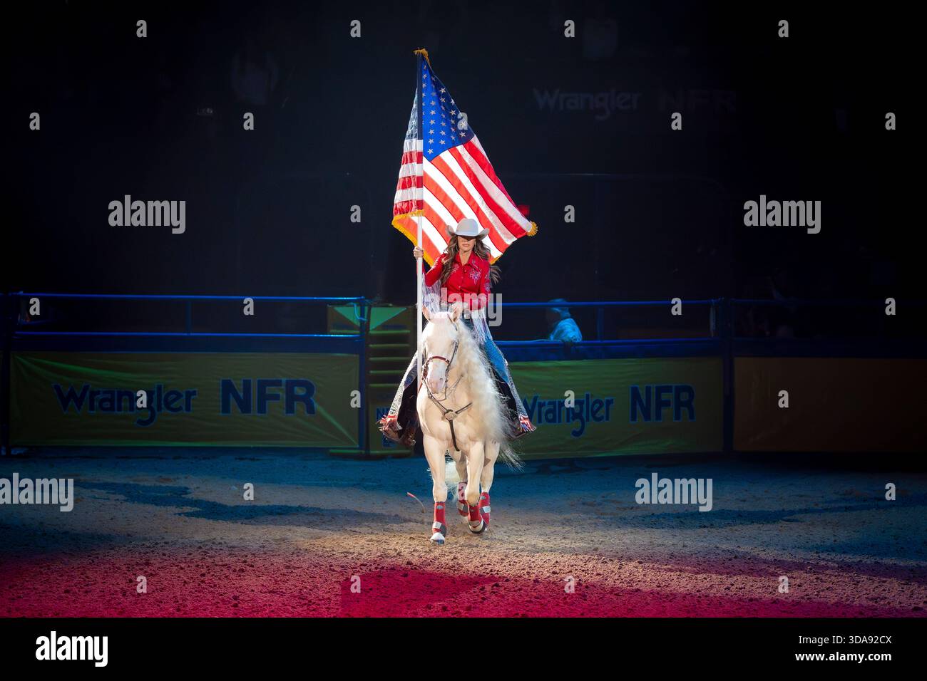 Anthem Rodeo Secretary of Homeland Security Kristi Noem carries the U.S. flag on ...