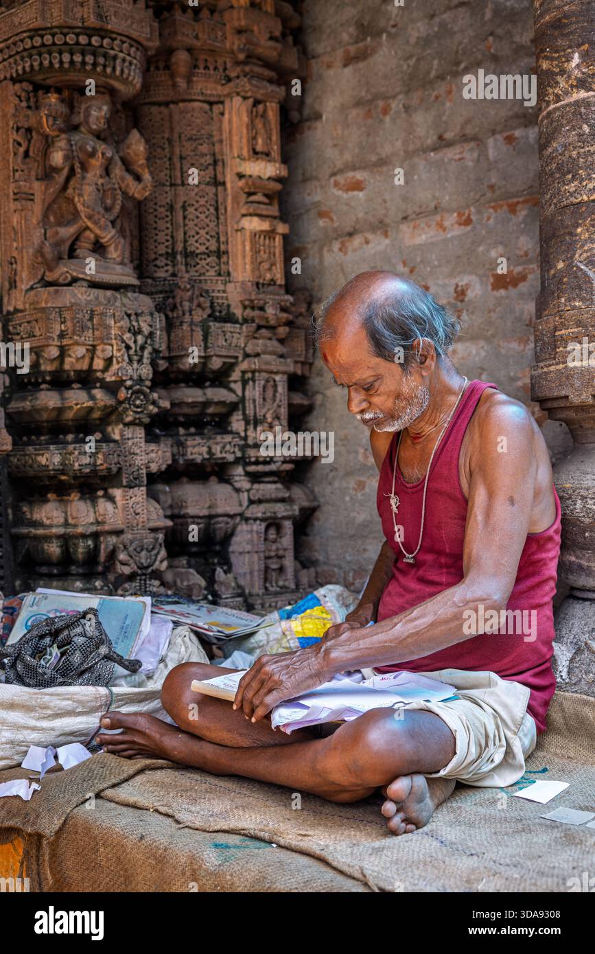 A street accountant for hire working outside, Puri, India Stock Photo