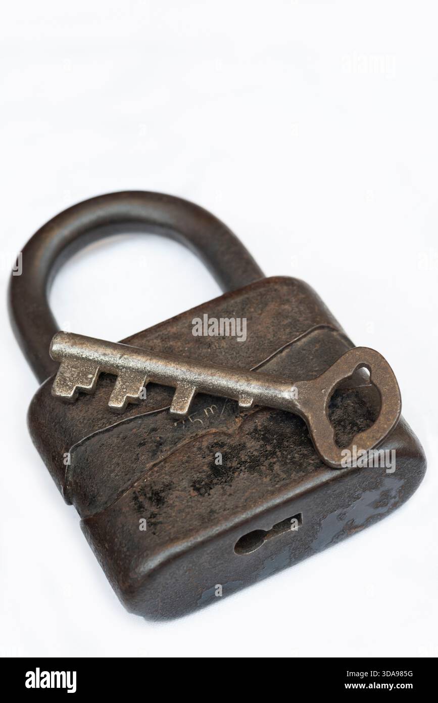 Rusty Old Padlock with Key, Isolated on White Background Stock Photo