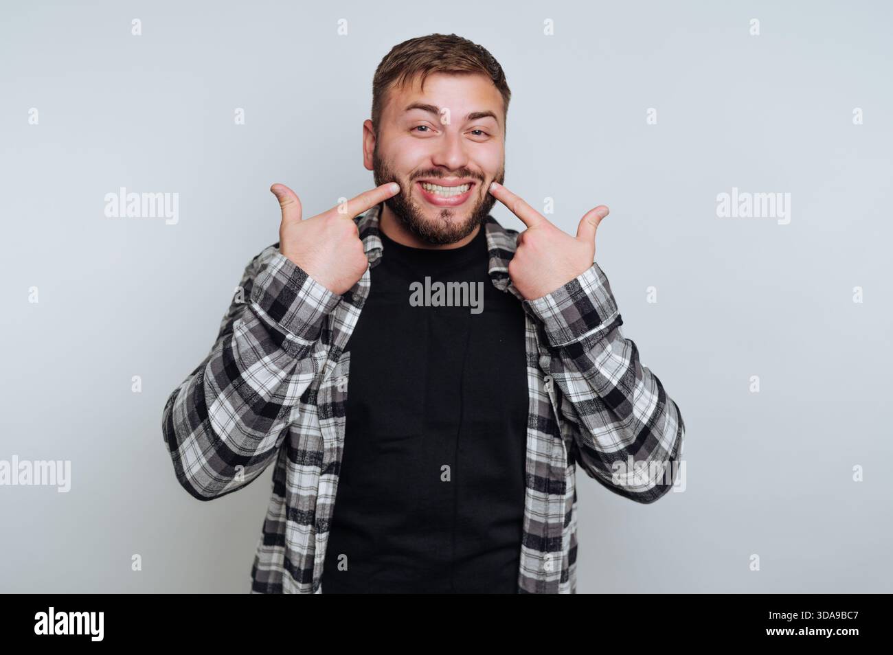 Young man wearing plaid hi-res stock photography and images - Alamy