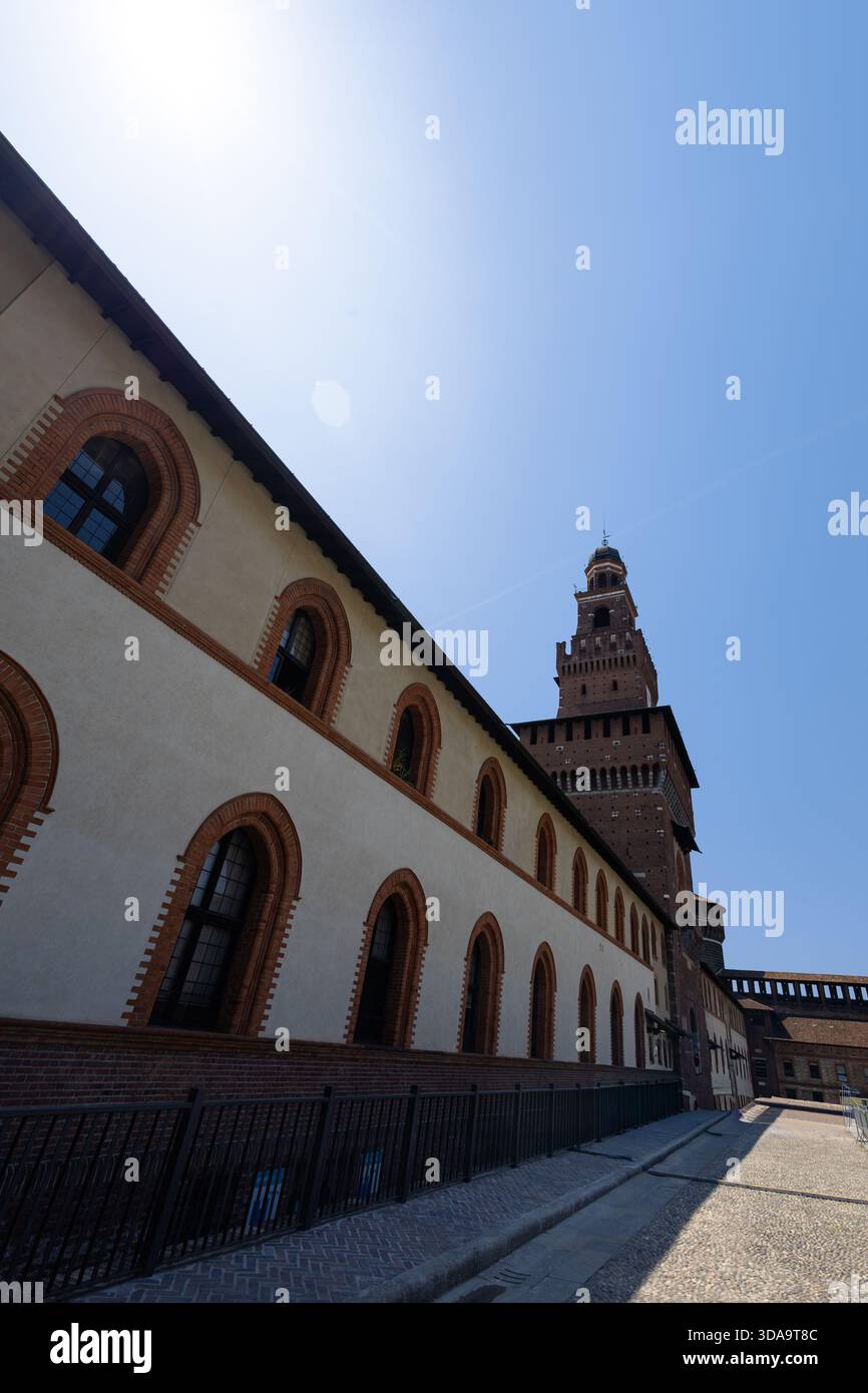 Old Buildings Rounded A historic brick building with rounded arched windows and a tall brick ...