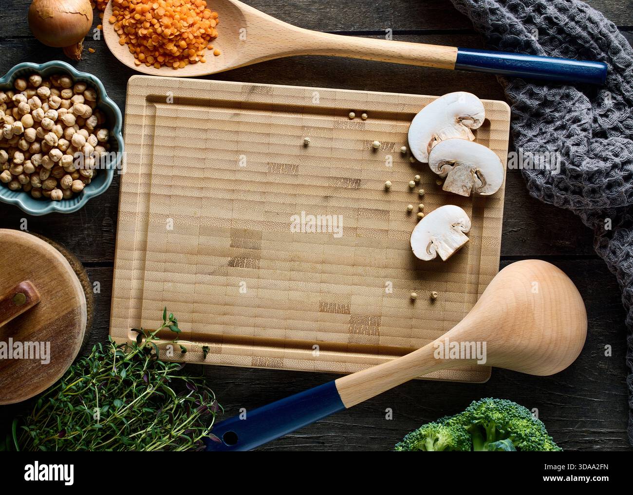 cooking tools on rustic dark wooden table surface, top view Stock Photo