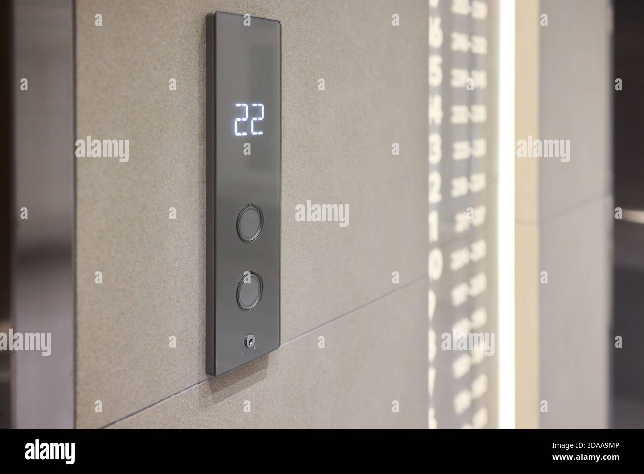 High-tech elevator panel featuring tactile buttons and illuminated screen, Advanced elevator interface showcasing touch sensitive controls alongside Stock Photo