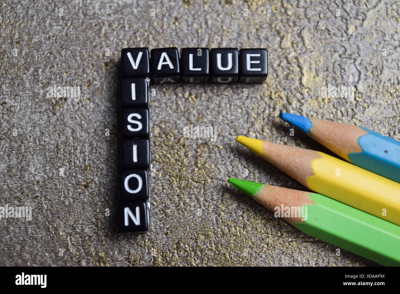 Concept of value and vision words arranged with on wooden letter blocks. Stock Photo