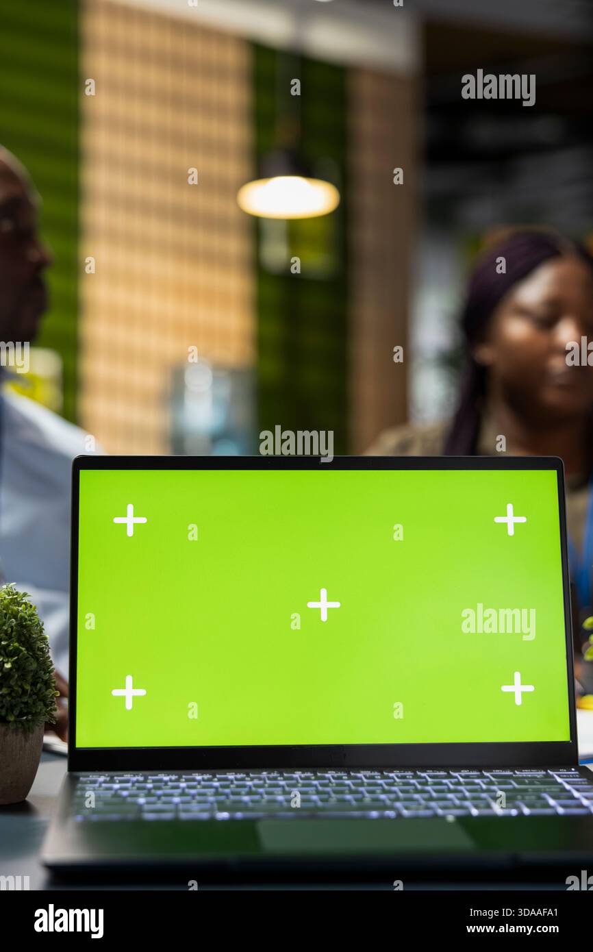 Isolated screen laptop used by admins in Silicon Valley office developing software apps. Chroma key notebook used by IT professionals to code, debugging applications to resolve issues, close up Stock Photo