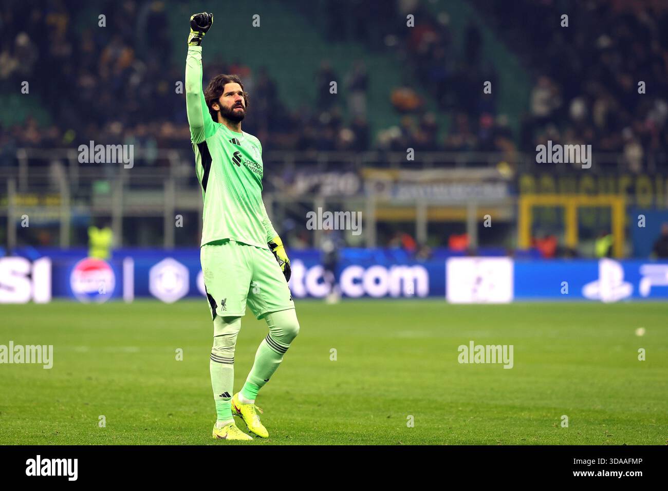 Liverpool goalkeeper Alisson Becker celebrates in front of the fans ...
