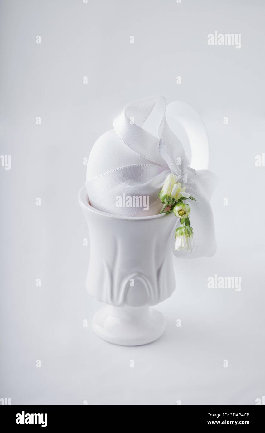 Easter Egg packed as a gift on white background Stock Photo