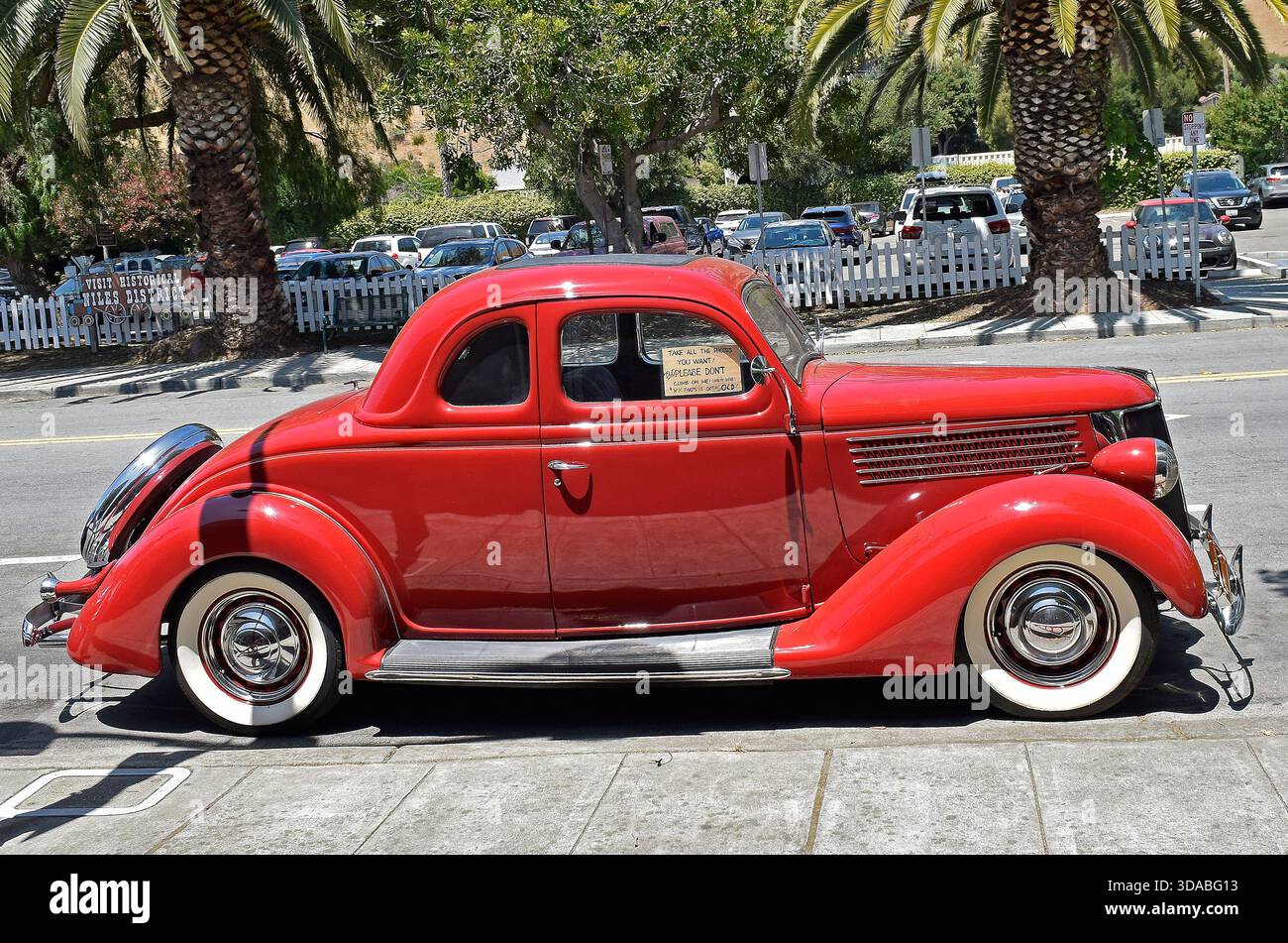 antique red Ford, car parked in Niles, California Stock Photo