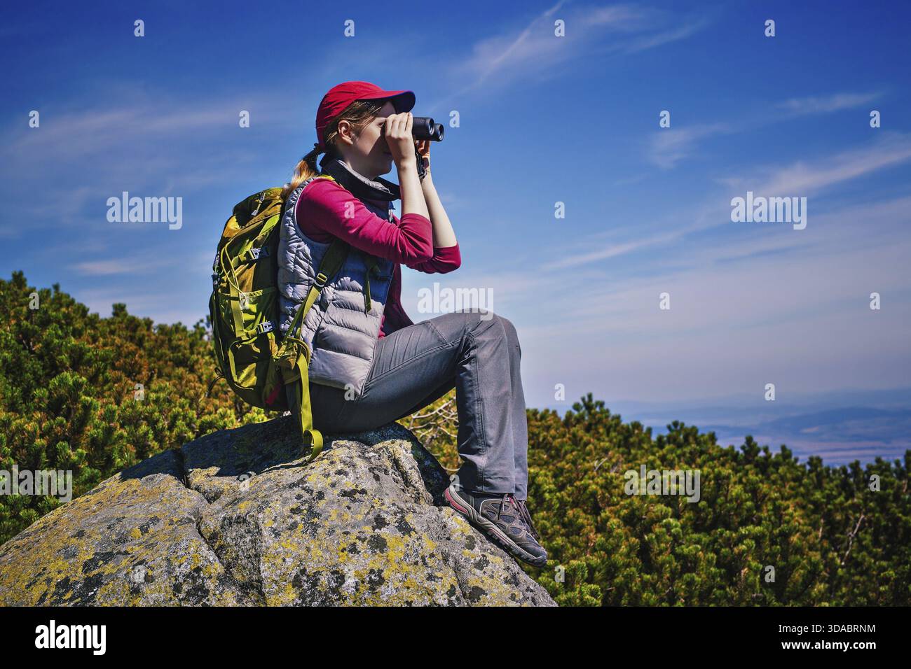 Woman mountain top binocular hi-res stock photography and images - Alamy
