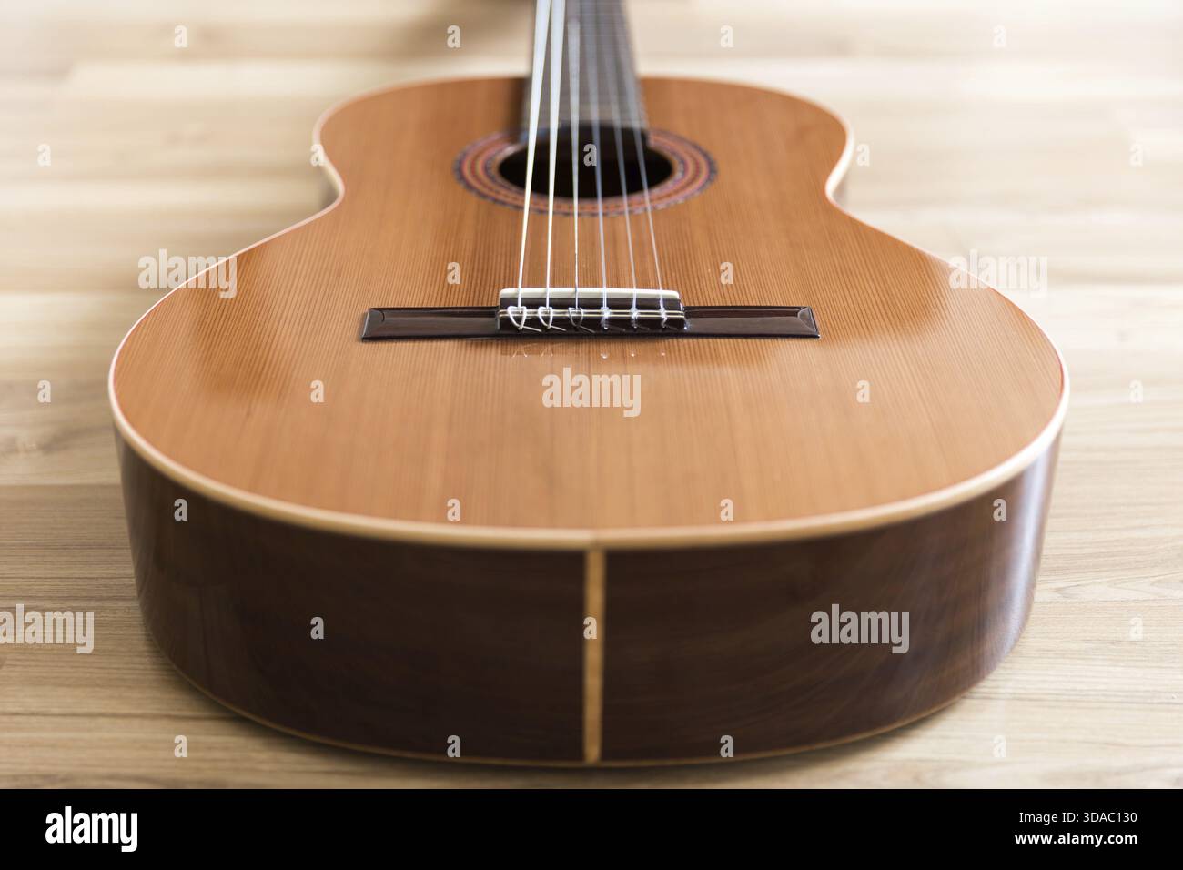 A classical guitar with six nylon strings Stock Photo