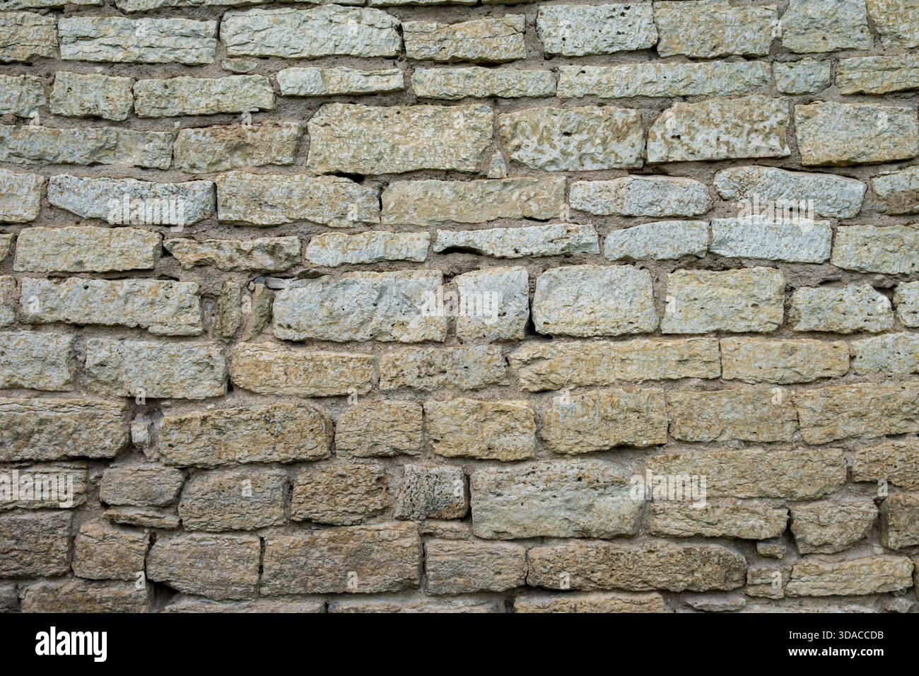 Textured Stone Brick Wall Detail and Surface View Stock Photo
