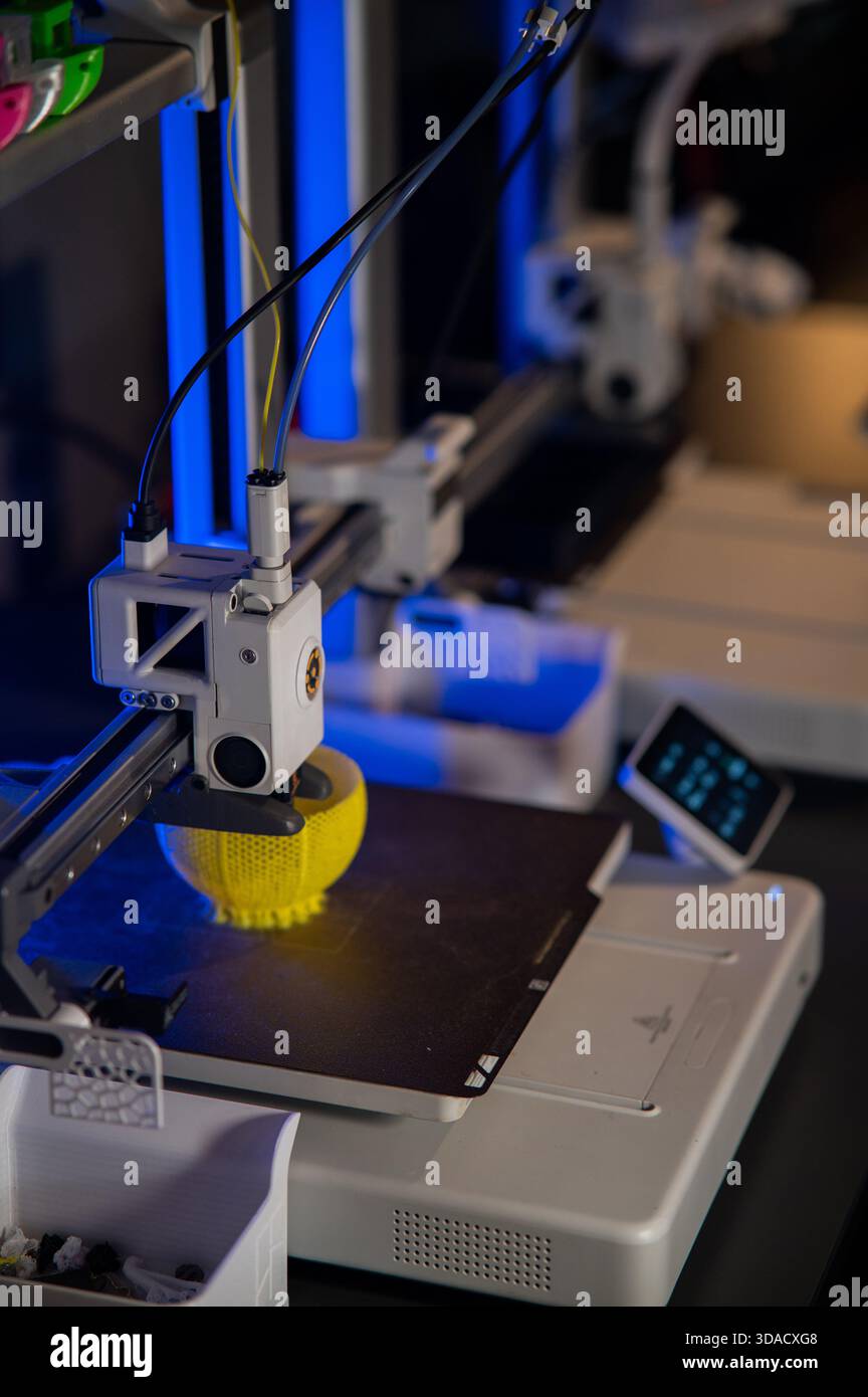A student man print prototype on 3D printer Stock Photo