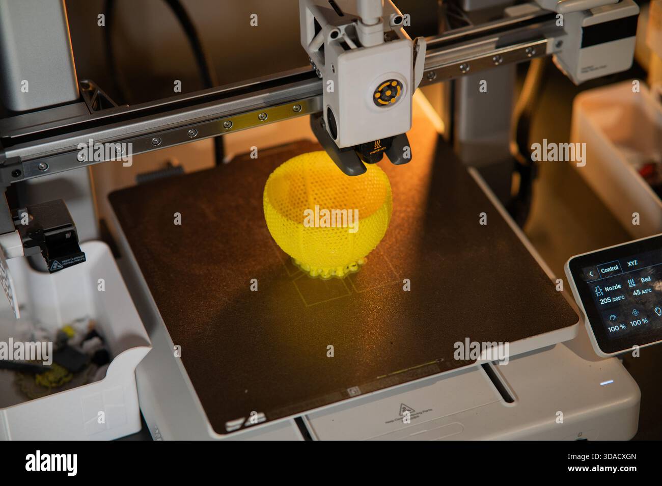 A student man print prototype on 3D printer Stock Photo