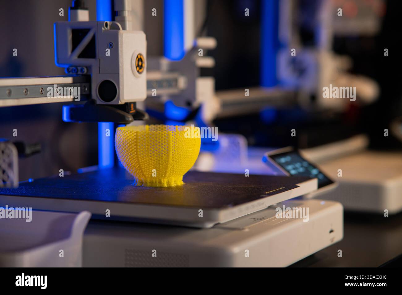 A student man print prototype on 3D printer Stock Photo