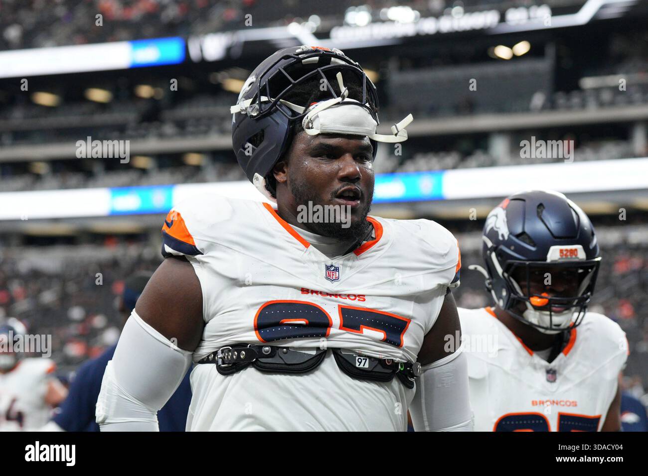 Denver Broncos defensive tackle Malcolm Roach (97) warms up before an ...