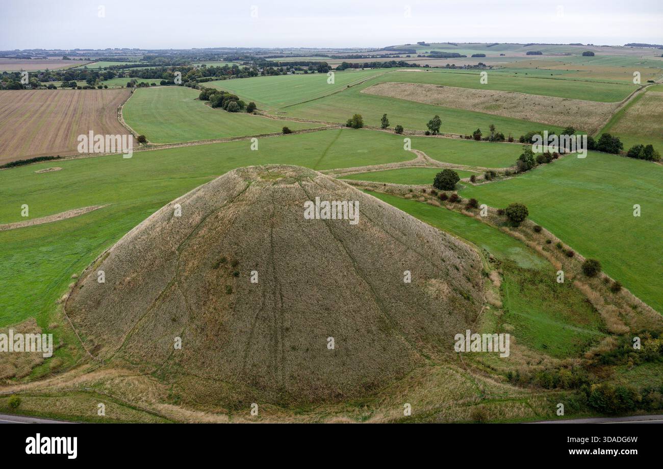Silbury Hill prehistoric man made chalk and clay mound near Avebury stone circle henge, England. 39m high. Earliest dates from 2400BC. View from S Stock Photo